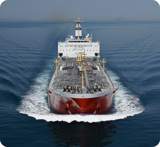 Large commercial cargo ship and oil tanker navigating open ocean waters, demonstrating fleet operations.
